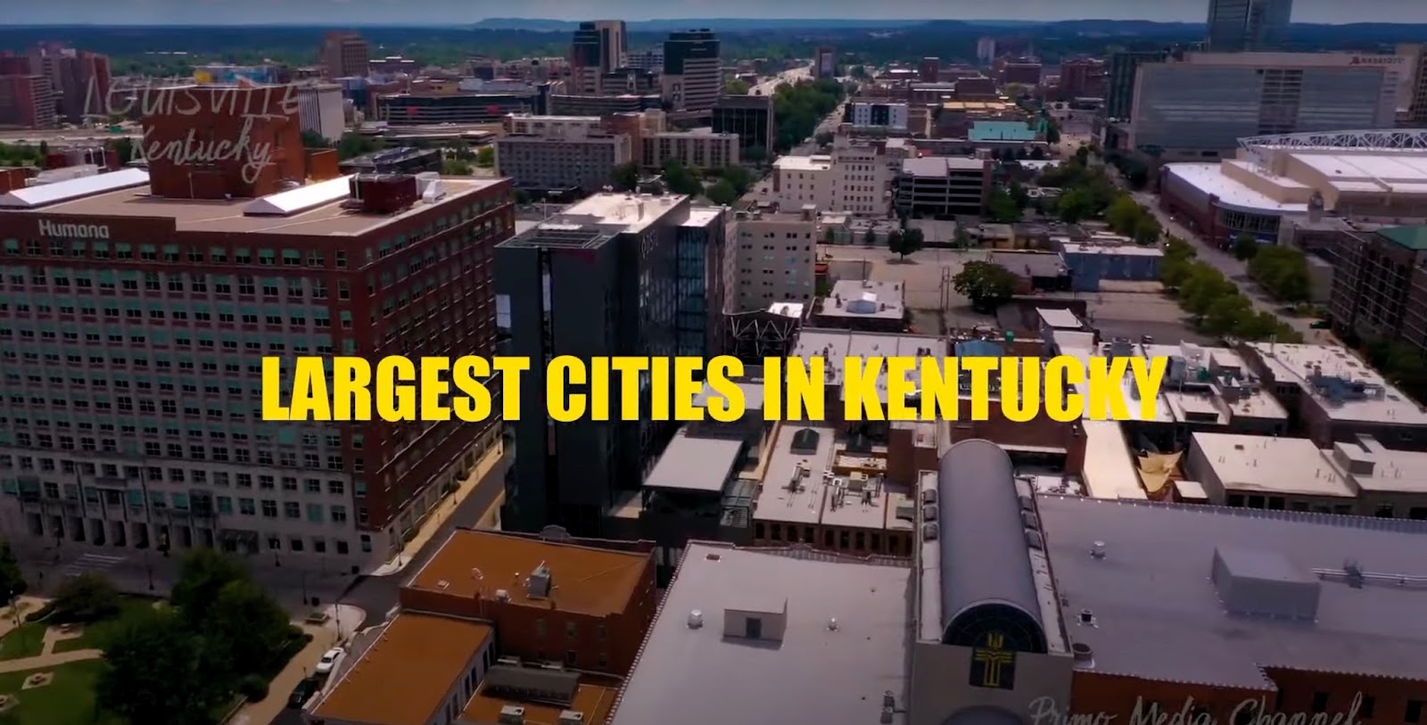 The inscription Largest Cities in Kentucky against the background of the city